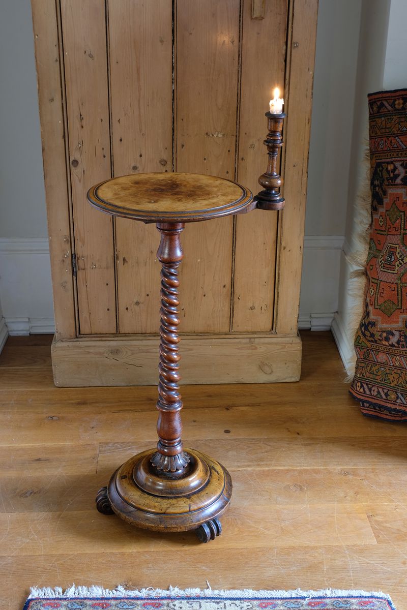 Mid-Victorian burr walnut candle stand with fixed candle arm and barley-twist column