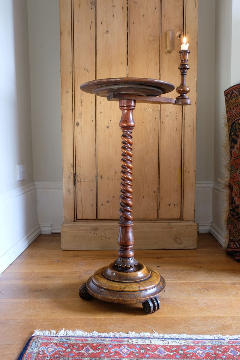 a view from the underneath on the Mid-Victorian burr walnut candle stand with fixed candle arm and barley-twist column