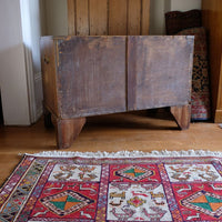 Rear of two-drawer campaign chest showing thin solid timber boards and central strip