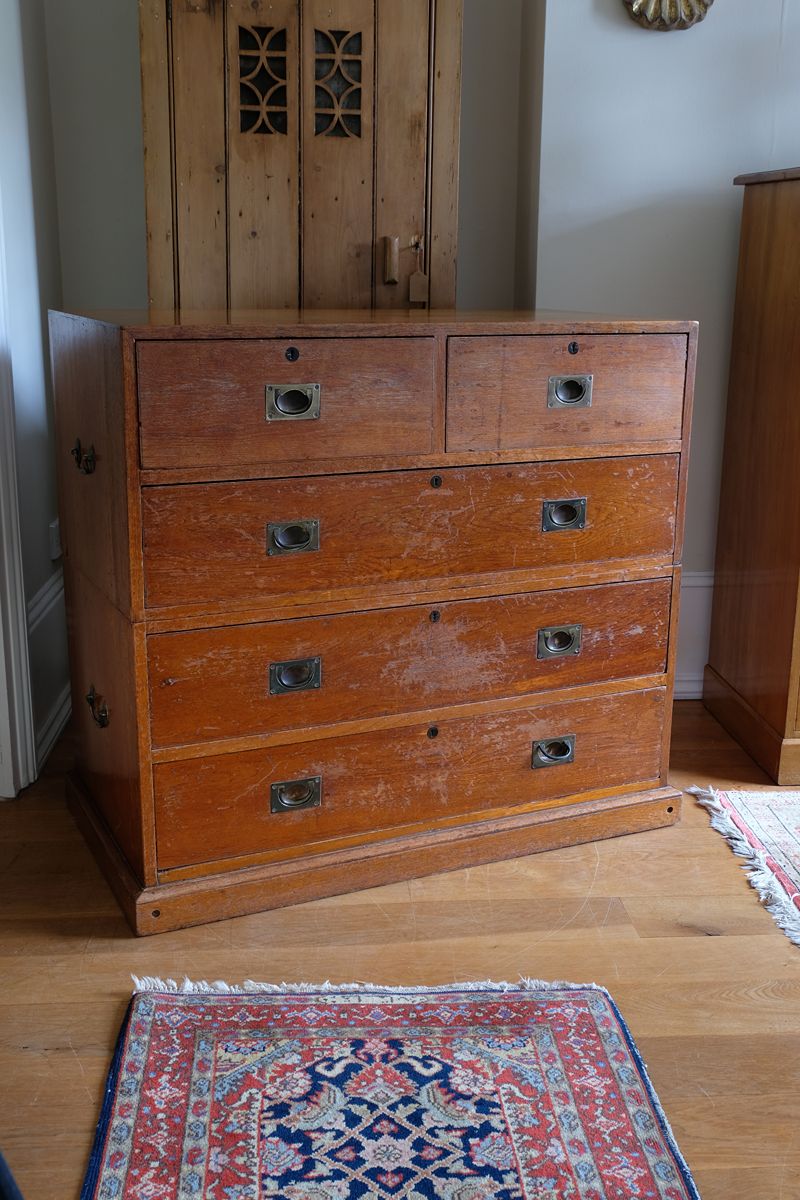 Mid-19th century camphor wood two-part campaign chest with five drawers and recessed brass handles.