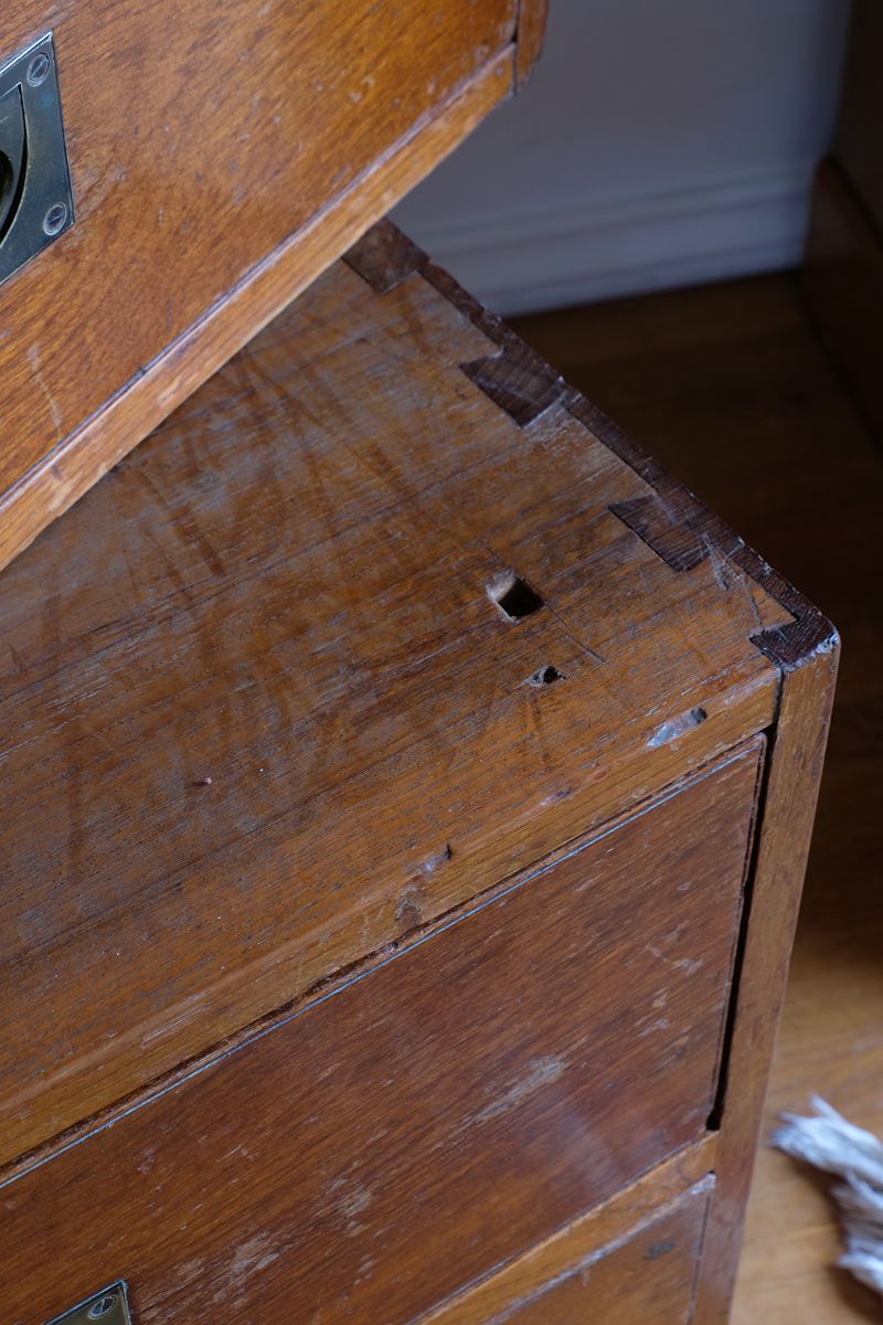 Hand-cut external carcass dovetails and locating aperture on the lower campaign chest section.