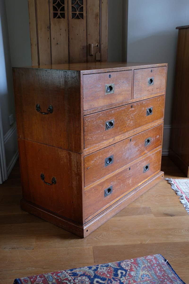 Mid-19th century camphor wood two-part campaign chest with five drawers and recessed brass handles.