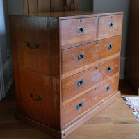 Mid-19th century camphor wood two-part campaign chest with five drawers and recessed brass handles.