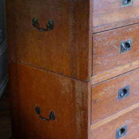 Close-up of recessed brass campaign drawer handle and original keyhole escutcheon.