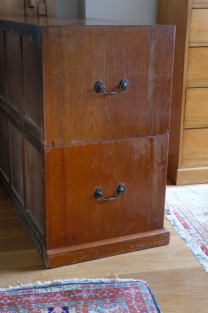 Close-up of recessed brass campaign drawer handle and original keyhole escutcheon.