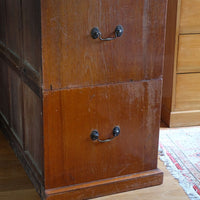 Close-up of recessed brass campaign drawer handle and original keyhole escutcheon.