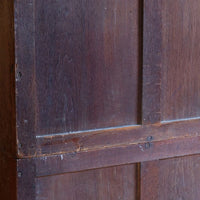 Rear of antique camphor wood campaign chest showing three-panel framed construction to both sections.