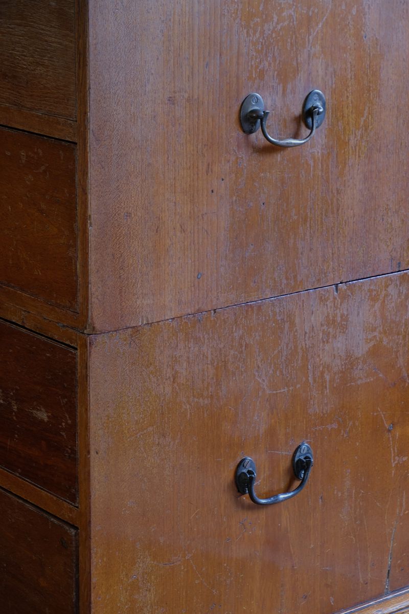 Mid-19th century camphor wood two-part campaign chest with five drawers and recessed brass handles.