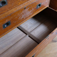 Open antique campaign chest drawer showing reinforced solid timber bottom and cross-bracing.