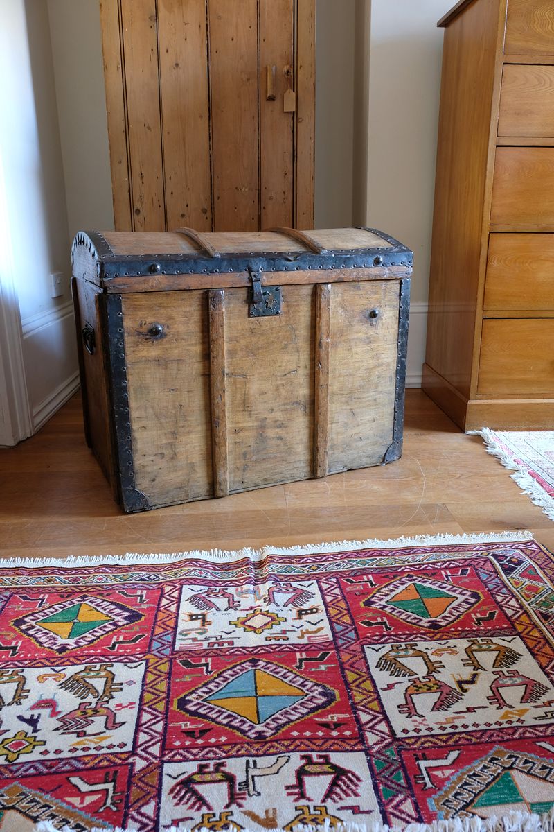 Antique Victorian pine domed trunk with iron straps and timber knock bars, circa 1880