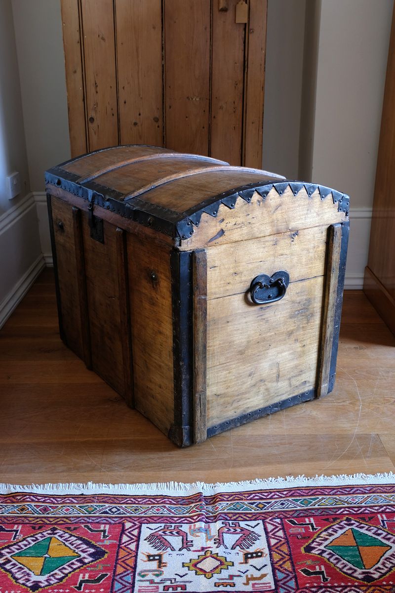 Antique Victorian pine domed trunk with iron straps and timber knock bars, circa 1880