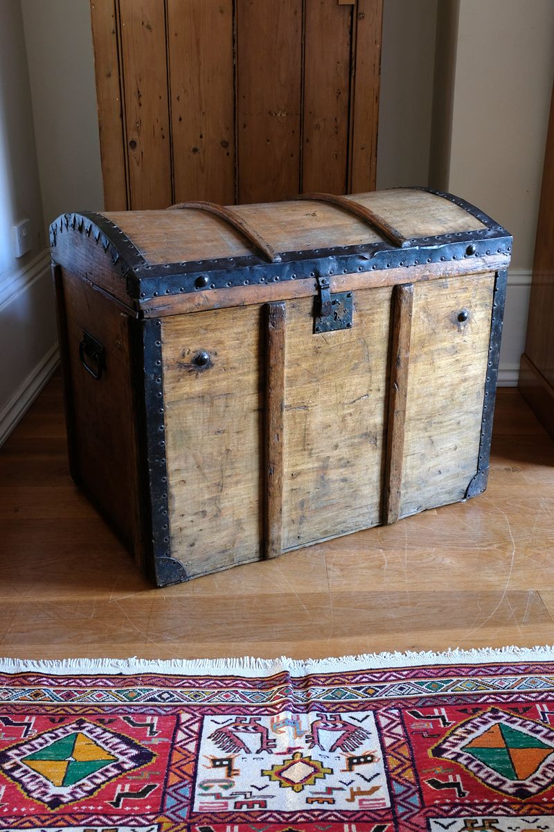 Antique Victorian pine domed trunk with iron straps and timber knock bars, circa 1880