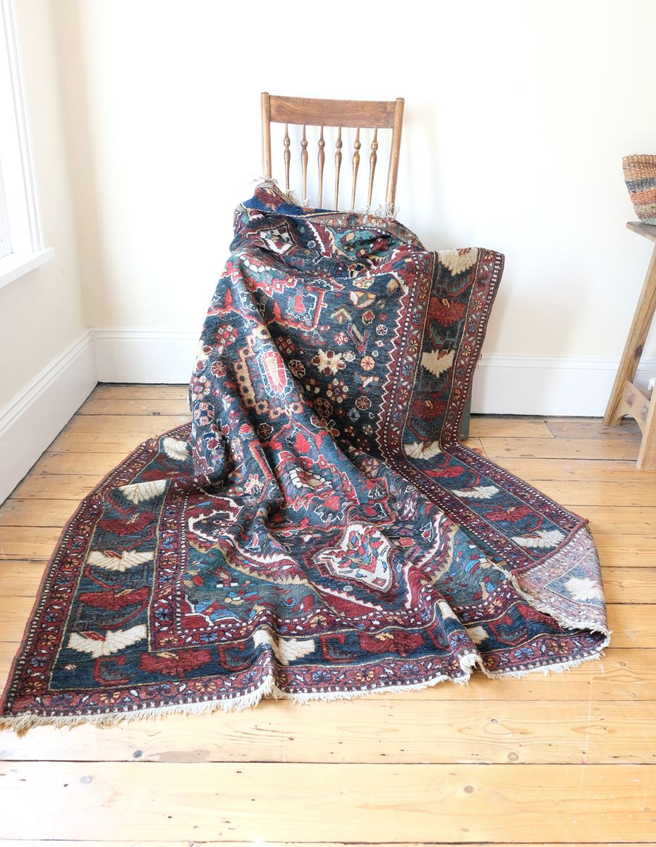 Early 20th century Persian Qashqai wool rug with indigo field, three medallions and blue-green corners, 244 × 159 cm