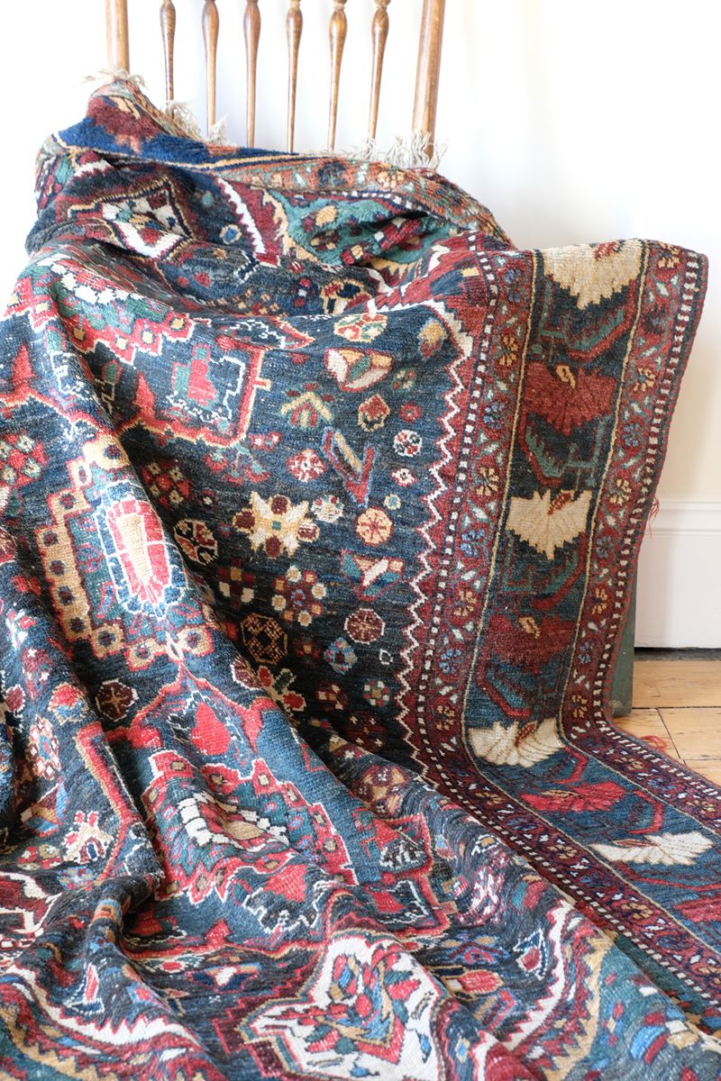 Early 20th century Persian Qashqai wool rug with indigo field, three medallions and blue-green corners, 244 × 159 cm