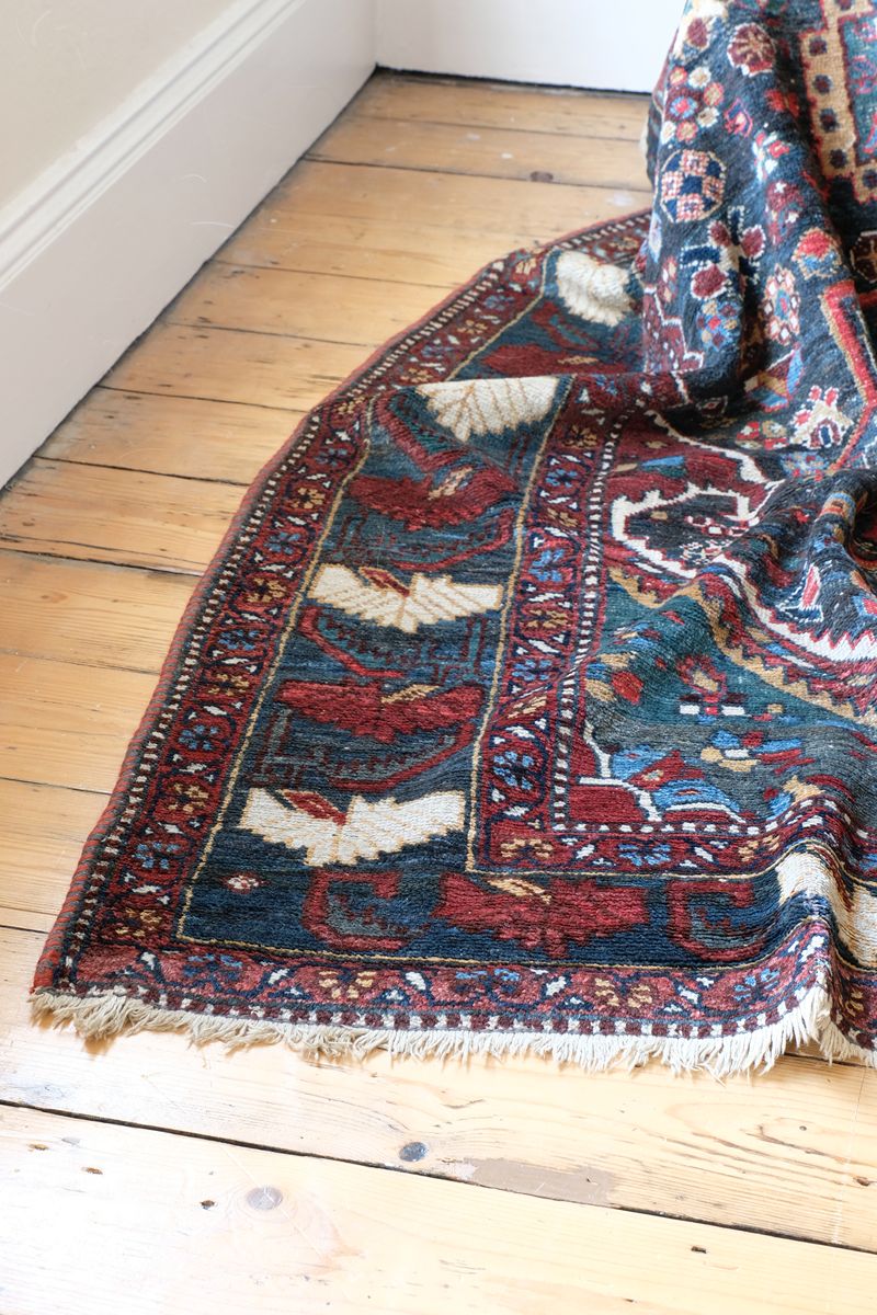 Early 20th century Persian Qashqai wool rug with indigo field, three medallions and blue-green corners, 244 × 159 cm