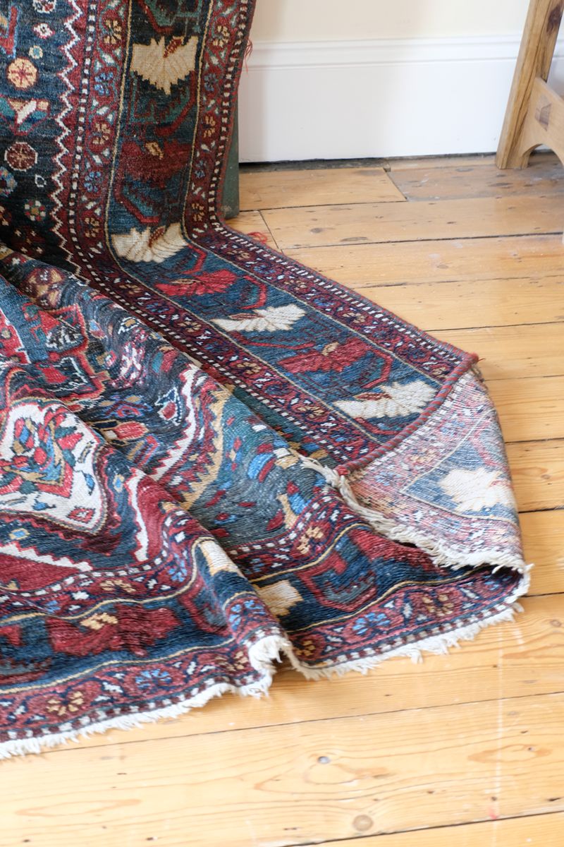 Early 20th century Persian Qashqai wool rug with indigo field, three medallions and blue-green corners, 244 × 159 cm