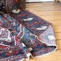 Early 20th century Persian Qashqai wool rug with indigo field, three medallions and blue-green corners, 244 × 159 cm