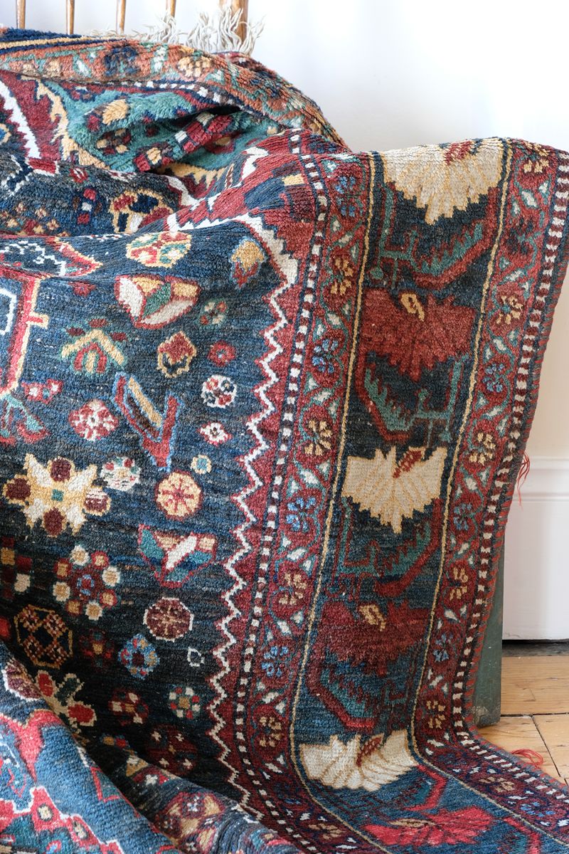 Early 20th century Persian Qashqai wool rug with indigo field, three medallions and blue-green corners, 244 × 159 cm
