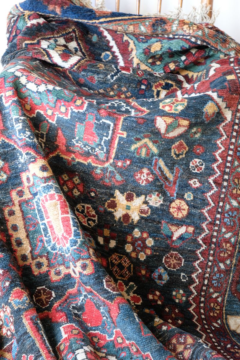 Early 20th century Persian Qashqai wool rug with indigo field, three medallions and blue-green corners, 244 × 159 cm