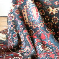 Early 20th century Persian Qashqai wool rug with indigo field, three medallions and blue-green corners, 244 × 159 cm