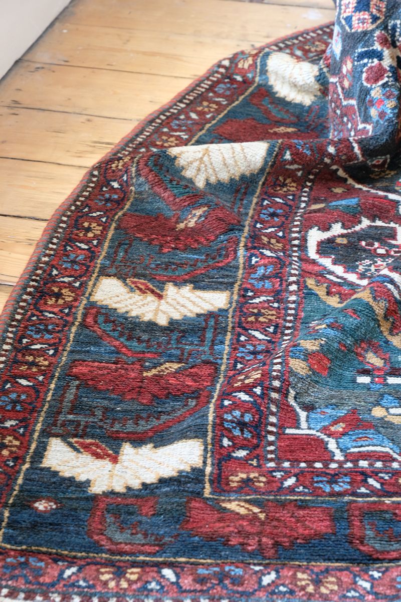 Early 20th century Persian Qashqai wool rug with indigo field, three medallions and blue-green corners, 244 × 159 cm