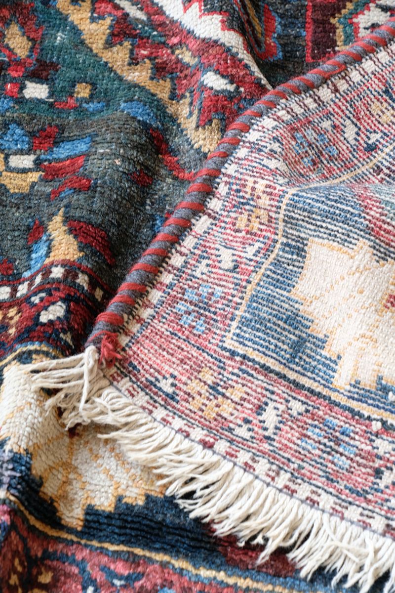 Early 20th century Persian Qashqai wool rug with indigo field, three medallions and blue-green corners, 244 × 159 cm