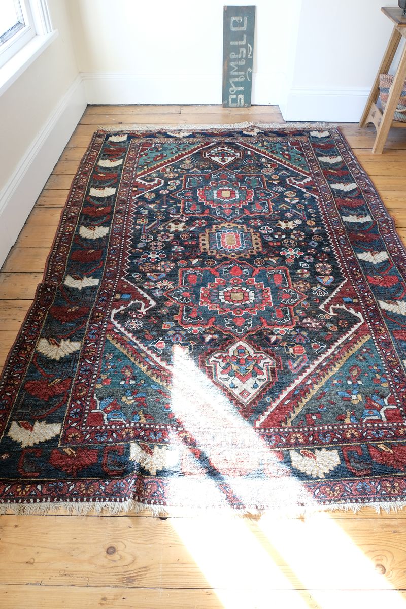 Early 20th century Persian Qashqai wool rug with indigo field, three medallions and blue-green corners, 244 × 159 cm