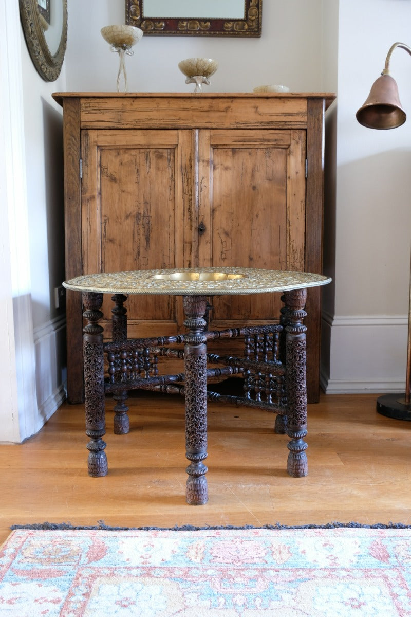 Anglo Indian Intricately Carved Table With A Decorative Brass Top