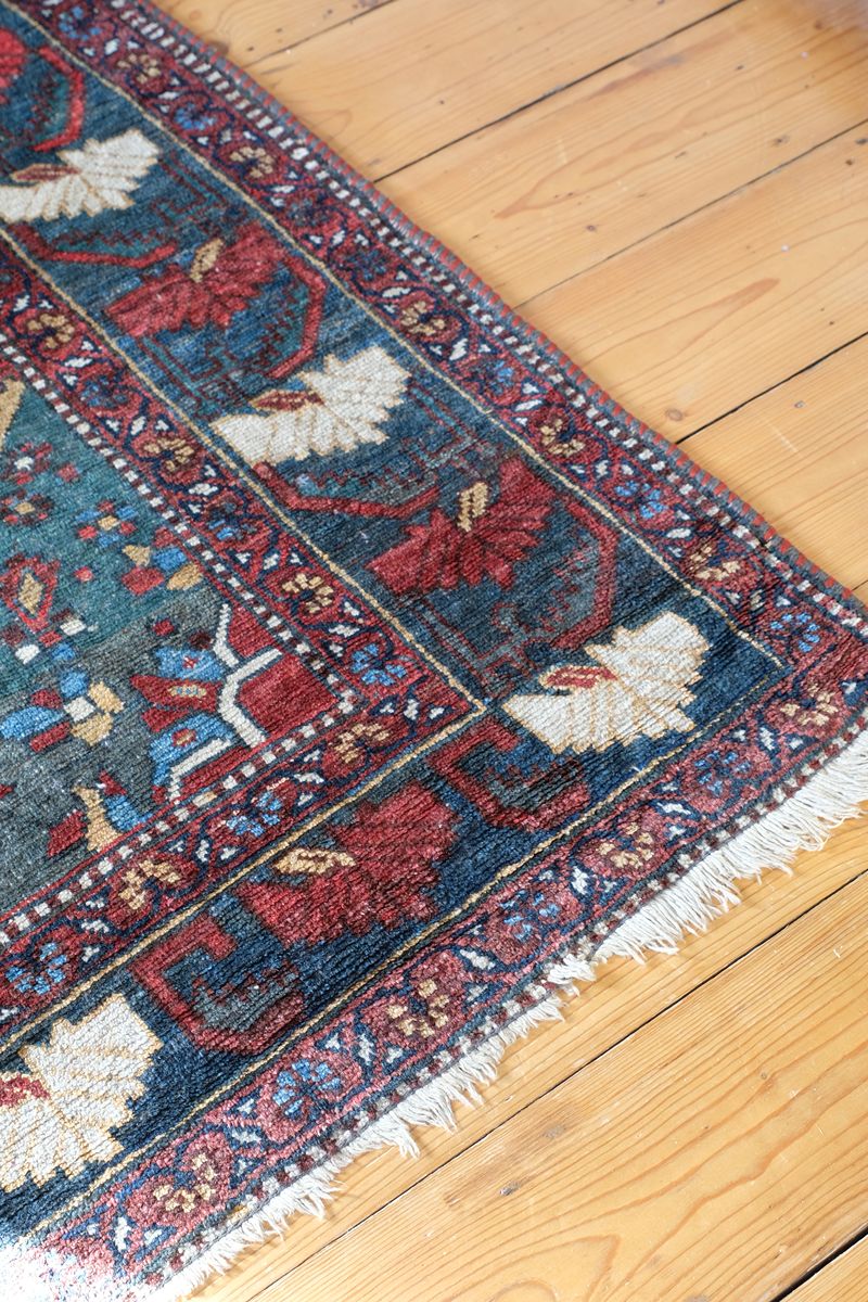 Early 20th century Persian Qashqai wool rug with indigo field, three medallions and blue-green corners, 244 × 159 cm