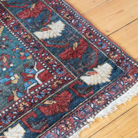 Early 20th century Persian Qashqai wool rug with indigo field, three medallions and blue-green corners, 244 × 159 cm