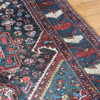 Early 20th century Persian Qashqai wool rug with indigo field, three medallions and blue-green corners, 244 × 159 cm