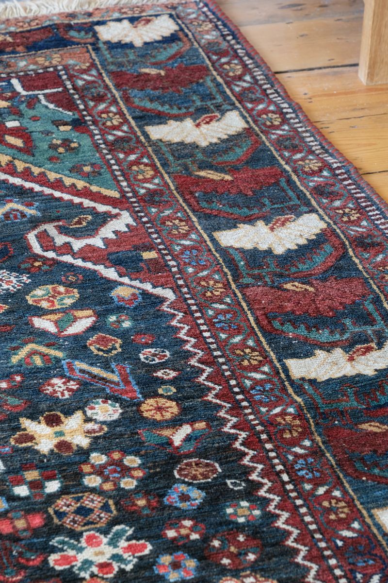 Early 20th century Persian Qashqai wool rug with indigo field, three medallions and blue-green corners, 244 × 159 cm