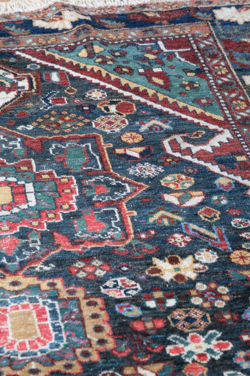 Early 20th century Persian Qashqai wool rug with indigo field, three medallions and blue-green corners, 244 × 159 cm
