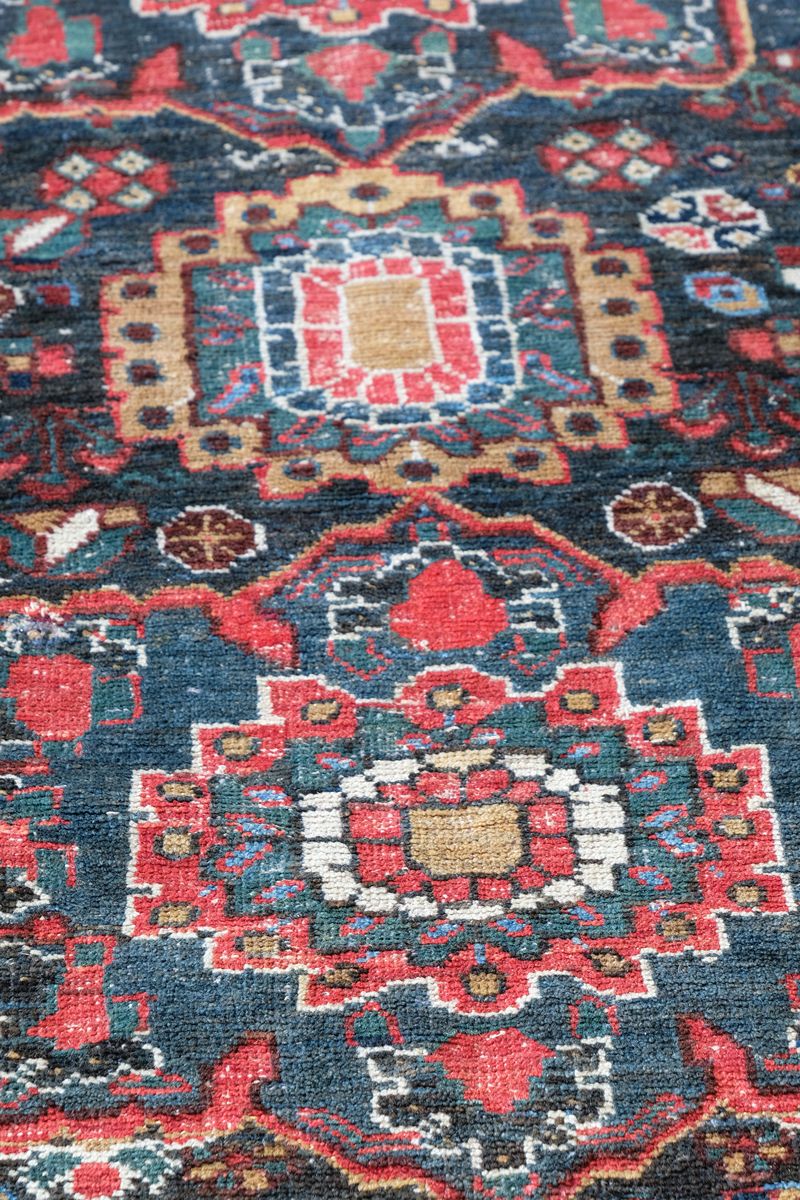 Early 20th century Persian Qashqai wool rug with indigo field, three medallions and blue-green corners, 244 × 159 cm
