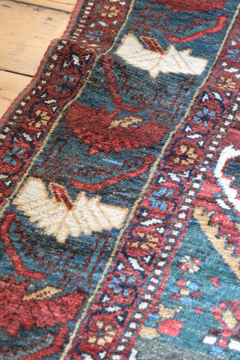 Early 20th century Persian Qashqai wool rug with indigo field, three medallions and blue-green corners, 244 × 159 cm
