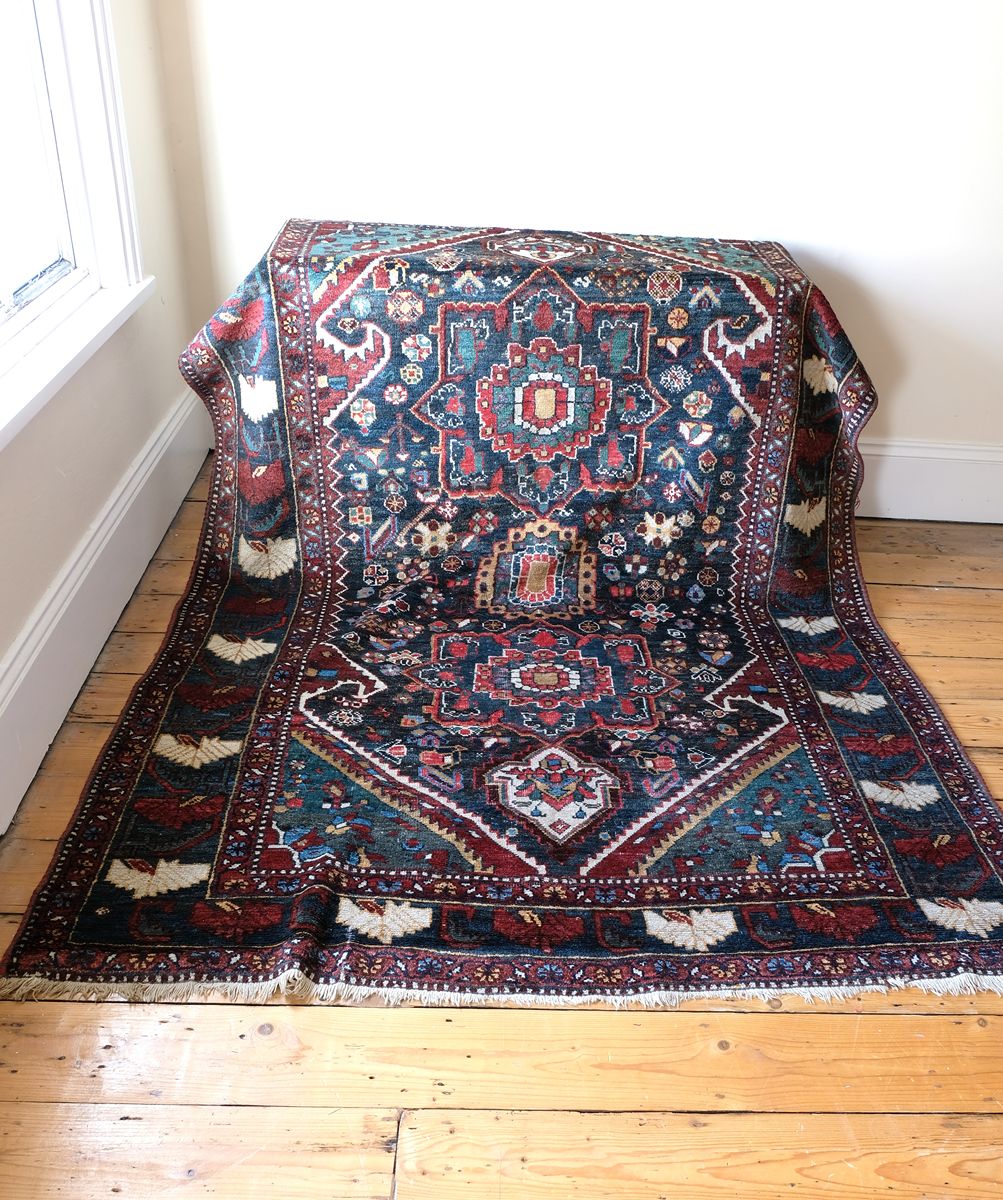 Early 20th century Persian Qashqai wool rug with indigo field, three medallions and blue-green corners, 244 × 159 cm