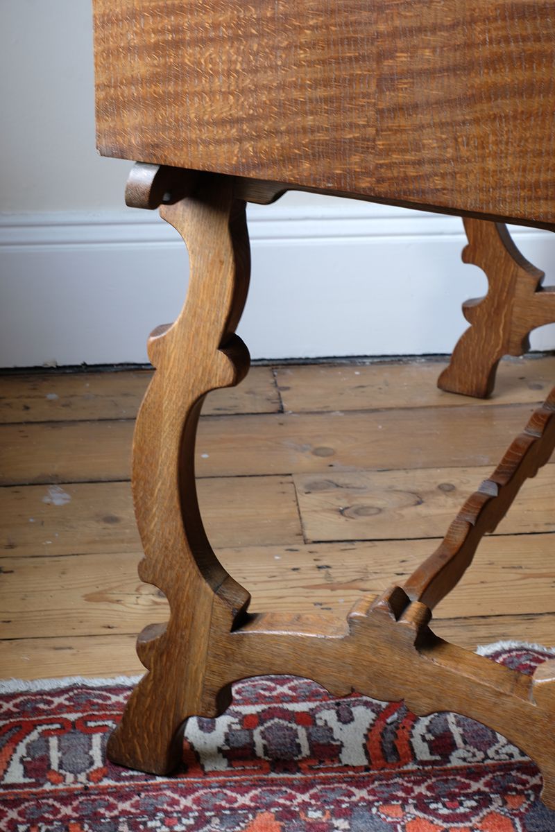 Shaped trestle supports with Spanish Revival influence o the Arts & Crafts Oak Console Table with Drawers – Beresford & Hicks