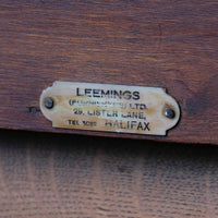 Leemings Halifax ivorine furniture supplier label on the Arts & Crafts oak console table by Beresford & Hicks with two drawers and shaped trestle supports