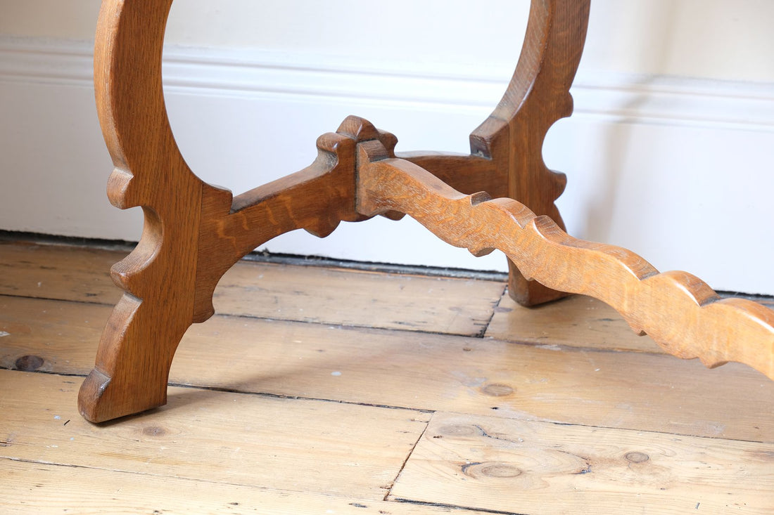 H ross stretchers on the Arts & Crafts oak console table by Beresford & Hicks with two drawers and shaped trestle supports