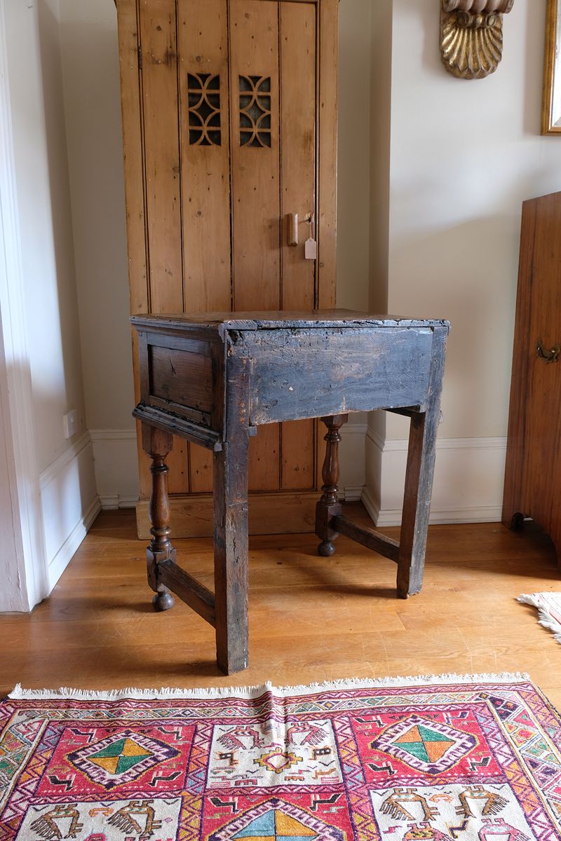 18th century country oak side table with a single panelled drawer, brass handles and baluster-turned front legs
