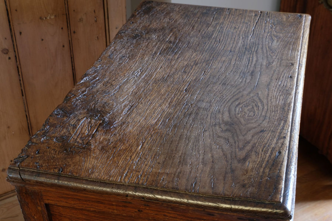18th century country oak side table with a single panelled drawer, brass handles and baluster-turned front legs