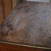 18th century country oak side table with a single panelled drawer, brass handles and baluster-turned front legs
