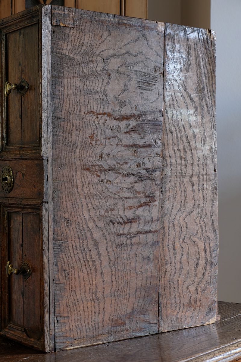 bottom of the drawer box on the 18th century country oak side table with a single panelled drawer, brass handles and baluster-turned front legs
