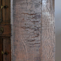 bottom of the drawer box on the 18th century country oak side table with a single panelled drawer, brass handles and baluster-turned front legs