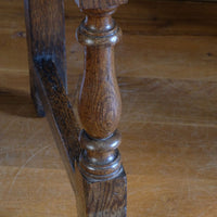 18th century country oak side table with a single panelled drawer, brass handles and baluster-turned front legs
