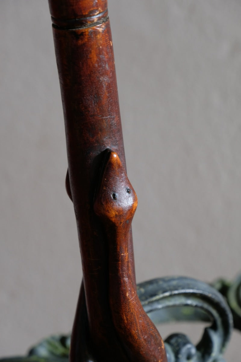 Mahogany walking stick in the form of entwined snakes