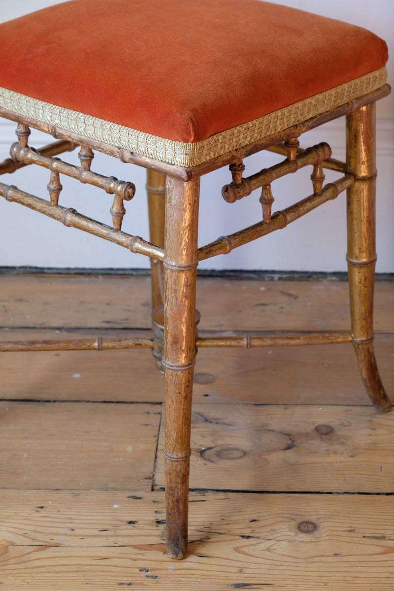 Regency giltwood faux bamboo music stool with swept out legs
