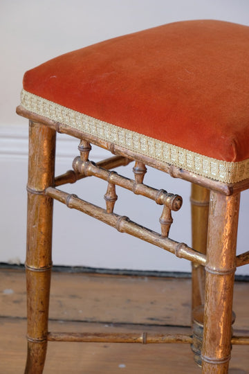 Regency giltwood faux bamboo music stool with swept out legs