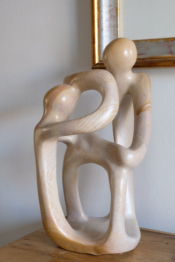 Abstract Stone Sculpture Of An Entwined Couple